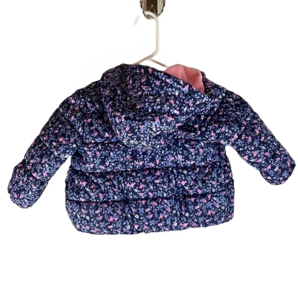 Carters Child’s Puffer Coat with Blue Floral Print. Size 18 months.